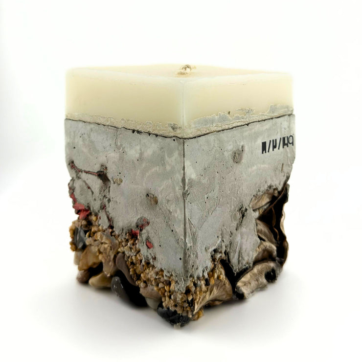 Candle with crystal stones and concrete